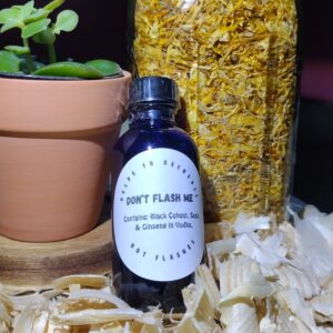 Herbal jar, essential oil, and potted plant.